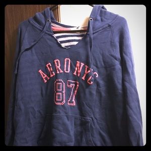 Cool blue hoodie with peach color writing